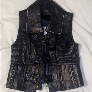 Black leather vest with gold trim